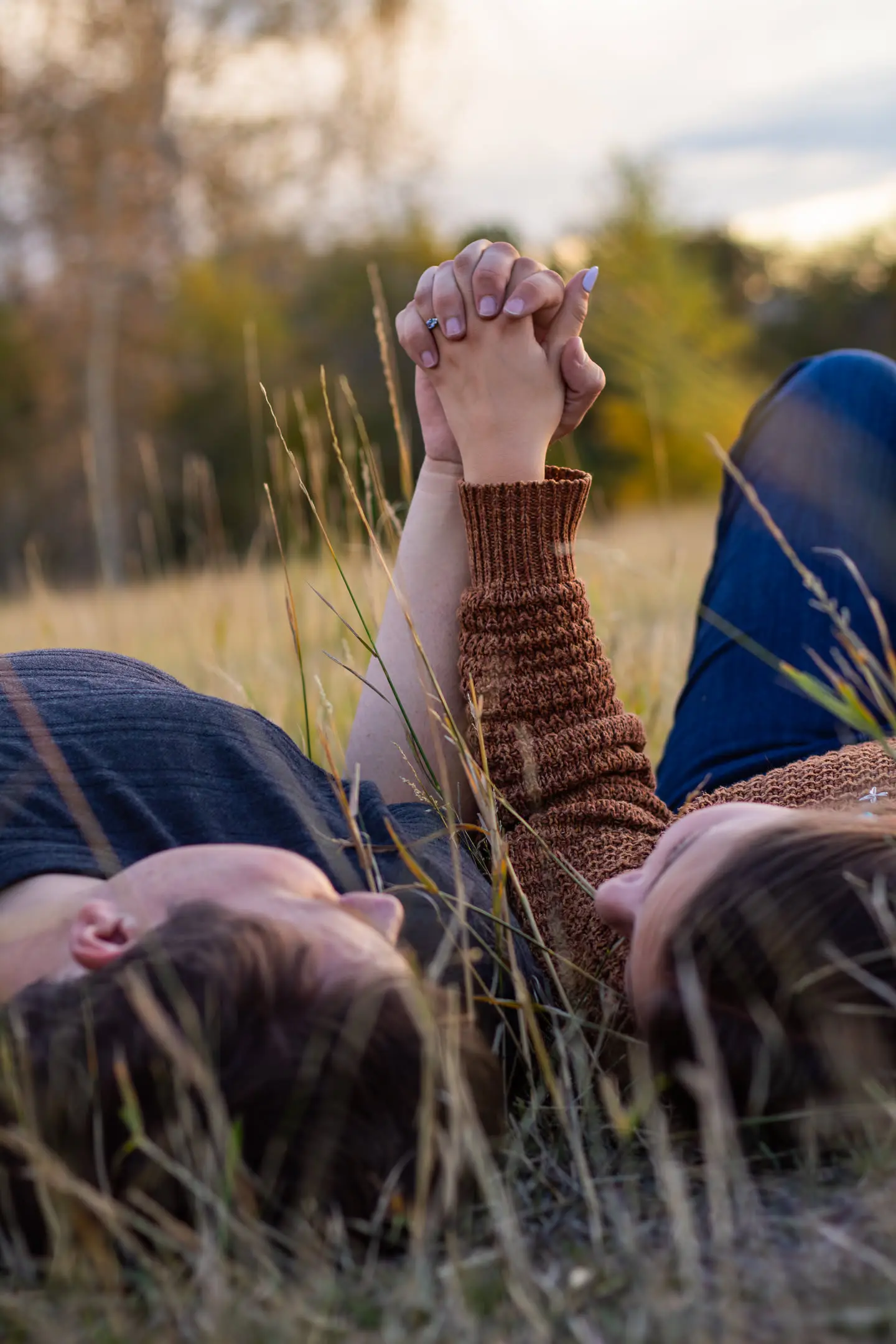 jacob hofer and makenna howard engagement hand hold